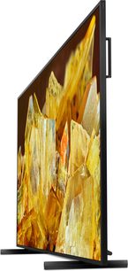 Sony XR98X90L højdefinitions-tv, sidevisning, slank skærm, rektangulær stander, billede af gule krystaller