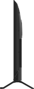 Televisor de alta definición Panasonic TV-55W95BEG en negro con plástico texturizado, panel delgado ligeramente curvado en la parte trasera visto de perfil, apoyado sobre un pie central en forma de V