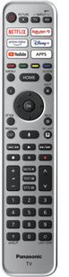 Sølvgrå Panasonic TV-fjernbetjening med sorte og hvide knapper til at styre Netflix, Rakuten TV, Disney+, YouTube, apps, menu, lydstyrke, kanaler