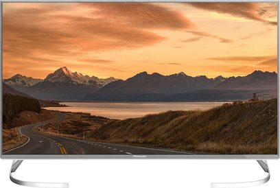 Panasonic TX-40EX700E-fladskærm, der viser et bjerglandskab ved en sø ved solnedgang, set forfra