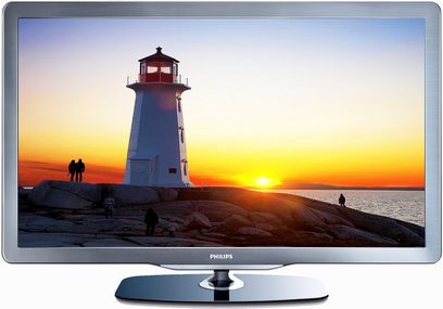 Philips 40PFL7605 TV-skærm, der viser et rødt fyrtårn ved solnedgang på en klippekyst med menneskelige silhuetter