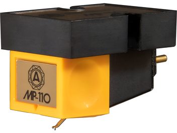Close-up of the Nagaoka MP-110 hi-fi cartridge, rectangular yellow and black plastic body, gold-colored metallic front plate with logo and inscription, stylus visible beneath the body, three-quarter view