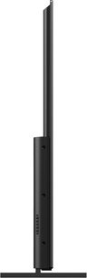 Televisore Panasonic TX-65JX800E, vista laterale, schermo piatto rettangolare nero, cornice sottile, piedistallo centrale nero