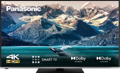 Panasonic TX-55LX610E 4K HDR Smart TV, der viser en hval, der springer ud af vandet i et snedækket bjerglandskab
