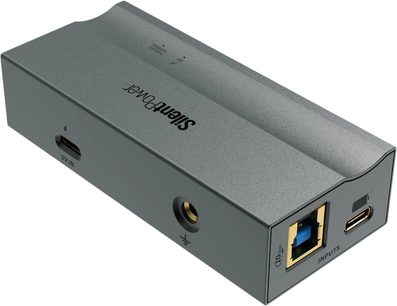 iFi Audio USB iPurifier Pro i aluminiumsgrå, skråt fra siden, med USB-B 3.0- og USB-C-porte, 5V IN, jordforbindelse
