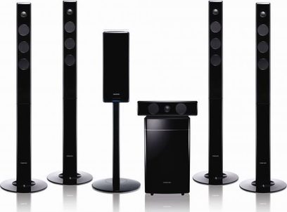 Samsung HT-TX500 home theater system consisting of 6 black tower speakers, 1 black subwoofer, and 1 black amplifier
