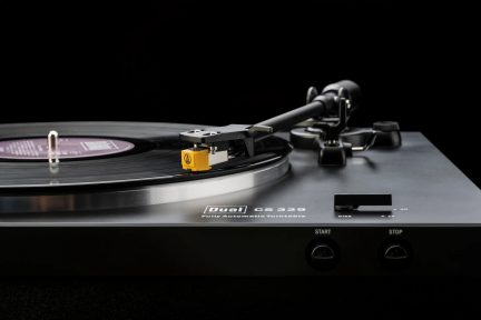 Black Dual CS 329 automatic turntable with record playing and gold Audio-Technica cartridge