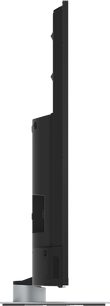 TV-65W93AE6 Panasonic, side view, sort fladskærm, sølvfarvet rektangulær stander, slankt profil, bagtilslutninger