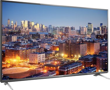Panasonic TX-40CX700 teler, mis näitab öist vaadet valgustatud linnale, lapik ekraan vaadatuna otse eest
