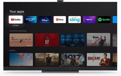TCL 65X925 fladskærms-TV, der viser en startskærm med streaming-videoapplikationer og miniaturebilleder af film og tv-serier