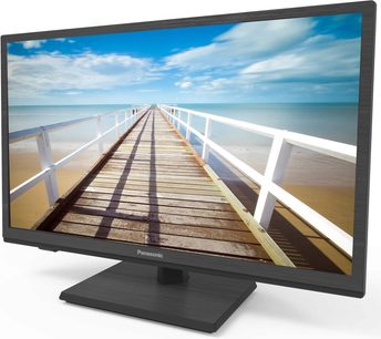 Panasonic TX-32G320E fladskærms-TV, der viser en træbro, der fører ud til havet under en blå, let overskyet himmel