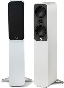 Pair of Q Acoustics 5040 white floorstanding speakers in a matte MDF cabinet, shown in a three-quarter view: one with a black branded front grille, the other revealing two black woofers and a central tweeter on a dark baffle, each resting on triangular metal spike feet.