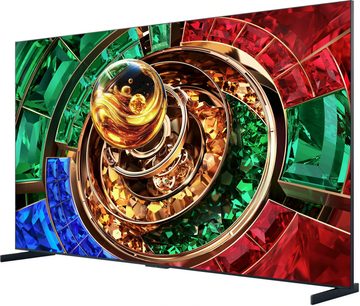 Černý plochý televizor TCL 85RM9L, pohled ze tří čtvrtin, abstraktní barevné zobrazení v červené, zelené, modré a zlaté barvě