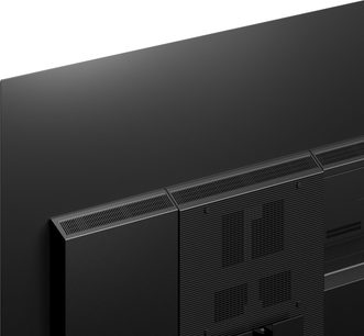 Téléviseur Panasonic TX-65MZ1500E, vue de côté, écran plat noir, cadre fin, grille haut-parleurs noire sur le côté