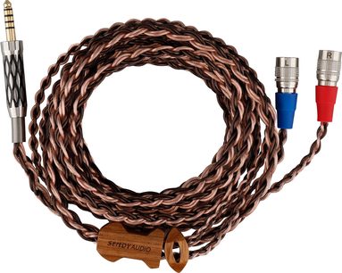 Stočený hnědý opletený kabel se spirálovým vzorem s modrým a červeným konektorem jack 6,35 mm na koncích