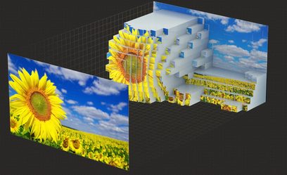 Proyector Sony BRAVIA Projector 9 (VPL-XW8100ES) negro, vista frontal, pantalla mostrando un campo de girasoles bajo un cielo azul