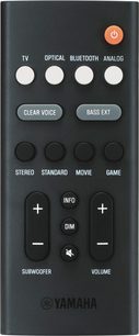 Sort Yamaha fjernbetjening med knapper til TV, optisk, Bluetooth, analog, stemme, bas, stereo, standard, film, spil, info, lydstyrke