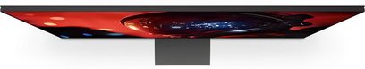 Televisor Sony BRAVIA 9 II K65XR9 visto de perfil ultrafino con pantalla de borde a borde y pie central negro