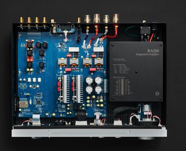 Rose RA280 silver stereo hi-fi amplifier, top interior view with blue circuit board and large capacitors