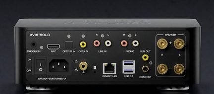 Black aluminum audio case, rear view, with power switch, IEC socket, HDMI ARC, optical and coaxial ports, RCA line and phono inputs, sub output, LAN port, two USB 3.0 ports, and four gold-plated speaker terminals