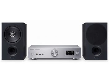 Technics hi-fi-anlæg med sølvfarvet forstærker med display og to sorte højttalere, hvoraf den ene har et rundt gitter