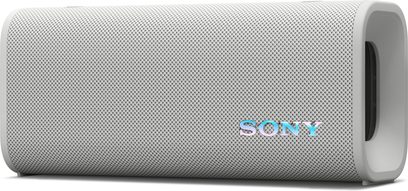 Draagbare Sony ULT Field 3 Bluetooth-luidspreker in het wit, cilindervormige behuizing met geweven textiel en gladde kunststof uiteinden, driekwart aanzicht van rechtsvoor