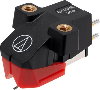 Audio Technica AT-VM95ML phono cartridge in a three-quarter front view, featuring a matte black plastic body with a brass insert, a translucent red stylus cover, and two silver rear pins.
