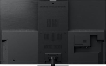 Televizor Panasonic TV-77Z93AEG s vysokým rozlišením, zadní pohled, centrální pruhovaný panel, konektory vpravo, středový stojan