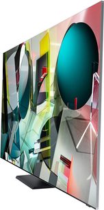 Fladskærms-TV fra Samsung QE65Q950TS med rektangulær multifarvet skærm med abstrakte geometriske former på sort fod