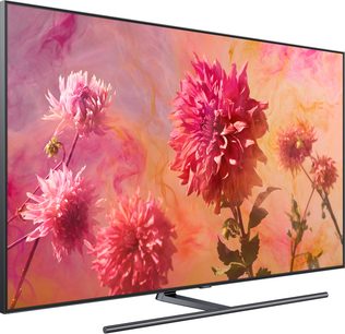 Televizor Samsung QE65Q9F 2018 zobrazující růžové a červené květy na oranžovém přechodovém pozadí, pohled zepředu
