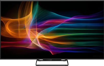Panasonic TN-55W95C-TV med tynn svart ramme og sentralt stativ, med fargerike lyslinjer mot svart bakgrunn