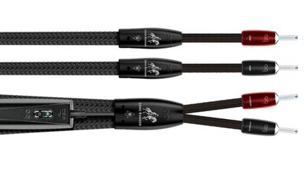 Three black braided audio cables with fabric sleeving, side view, black module with green LED, and red and black banana plugs