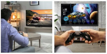 Television displaying a car racing video game, wireless game controller placed in front, hands of a man holding another controller