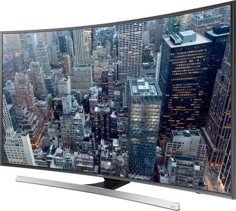 Samsung UE65JU7500 ultra HD 4K buet TV viser et luftfoto af skyskrabere i en storby om natten