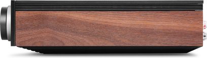 Amplificatore hi-fi stereo Cambridge Audio EVO 150SE, chassis rettangolare nero con pannello laterale in legno marrone, alette nere di dissipazione e manopola frontale in metallo grigio, vista laterale destra