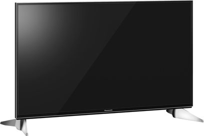 Panasonic TX-55EX600E fladskærms-TV, rektangulær sort skærm slukket, smal sølvfarvet ramme, står på to sølvfarvede fødder