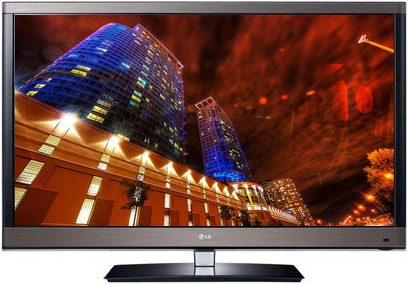LG 42LW570S fladskærms-LED-TV, frontvisning, tændt, viser en oplyst by om natten med blå og orange skyskrabere