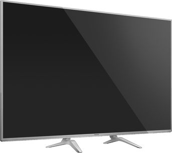Panasonic TX-65DX750E fladskærms-TV, 65 tommer LED-skærm, set lidt fra siden forfra, slankt sølvfarvet ramme, dobbeltgrensstativ