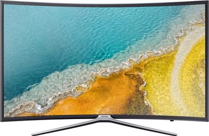 Samsung UE49K6300AKXZF buet TV viser et luftfoto af en strand med turkisblåt vand og gyldent sand