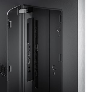 Loewe Vega 32 -televisio, musta, takanäkymä luukku auki ja HDMI-, USB-C- ja kuulokeliitännät näkyvissä