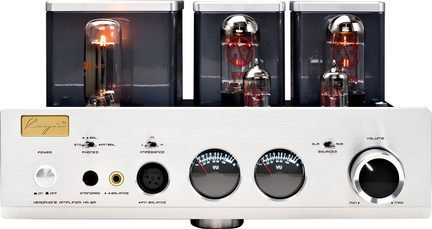 Amplificatore a valvole argentato in alluminio spazzolato, vista frontale, con tre tubi sotto coperture grigie, due vumetri circolari retroilluminati al centro, una grande manopola del volume cromata a destra e molteplici prese per cuffie sul pannello frontale