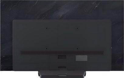Bagside af LG OLED55C5 TV i mat sort plast, fladt bagpanel med VESA-monteringshuller, perforeret horisontal ventilationsrist og central sokkelbase