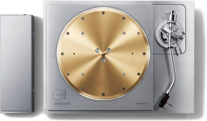 Technics SL-1000R hi-fi turntable top view with circular gold platter, silver tonearm, and rectangular casing on the left