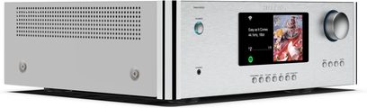 Amplificatore hi-fi integrato stereo Rotel RAS-5000, vista di tre quarti, frontale argentato, manopola del volume circolare, schermo centrale