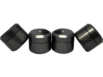 Juego de cuatro amortiguadores antivibración Aktyna ENO cilíndricos de metal negro satinado con grabado lateral y orificio roscado centrado en la parte superior, vista frontal en ligera perspectiva