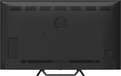 Panasonic TV-65W95BEG sort fjernsyn i tekstureret plast, bagpanel med øvre og nedre ventilationsgitter, fremstående central skive, sideklapper til tilslutninger og V-formede metalben, bagsidevisning