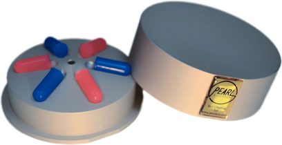 Amortiguador ISOL-Coupling 2.0, vista desde arriba, cilindro blanco, 6 extremos cilíndricos azules y rosas, placa dorada