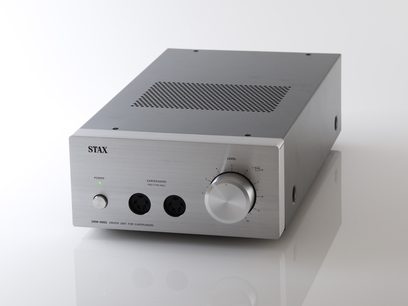 STAX SRM-400S sølvfarvet hovedtelefonforstærker, set forfra, frontpanel med drejeknap, 2 hovedtelefonstik og kontakt