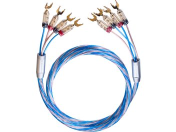 Kabel reproduktorů Oehlbach Bi-Tech 4.4 L modrý a měděný v průhledném plastovém plášti, pohled shora, navinutý, s dvojitými koncovkami ve zlatých kovových vidlicích s červenými a černými kroužky a šedými kovovými pouzdry
