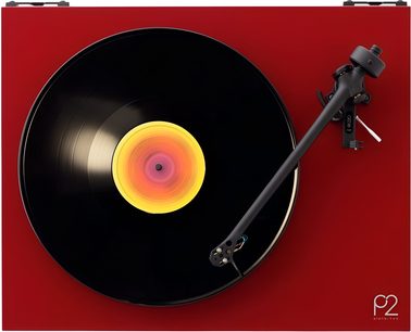 Top view of a red lacquered Rega Planar 2 turntable, black platter with a record and a yellow-to-pink gradient label